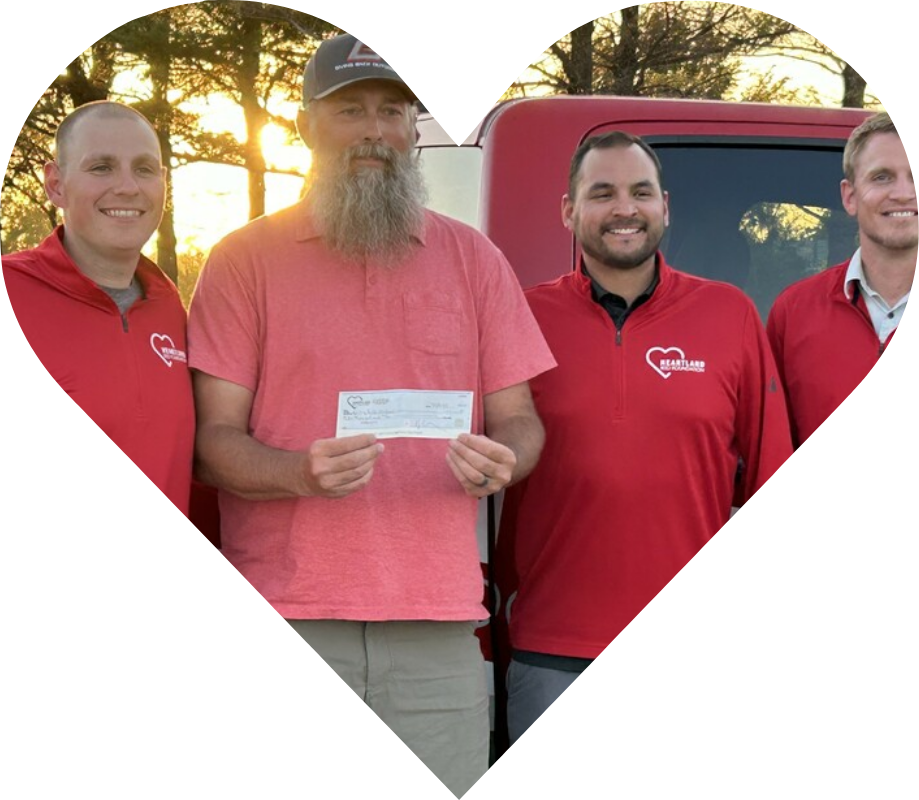 Heartland team with the winner of a giveaway