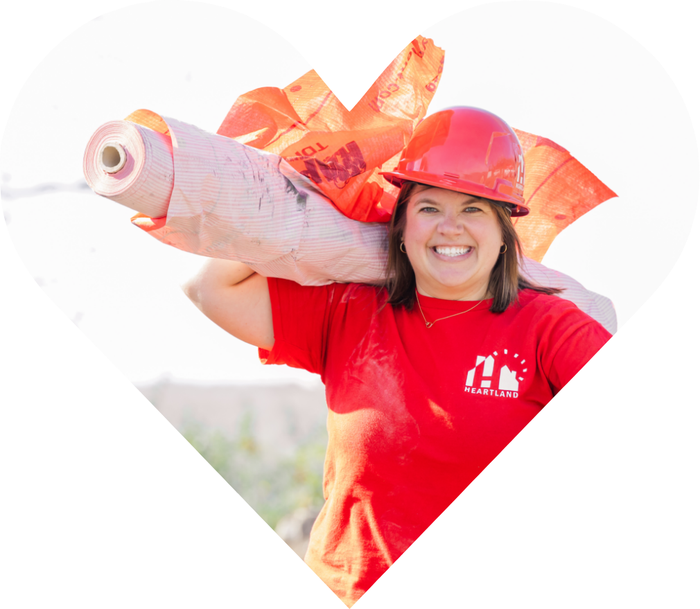 Heartland Team Member Carrying Roofing Materials for Roofing Giveaway